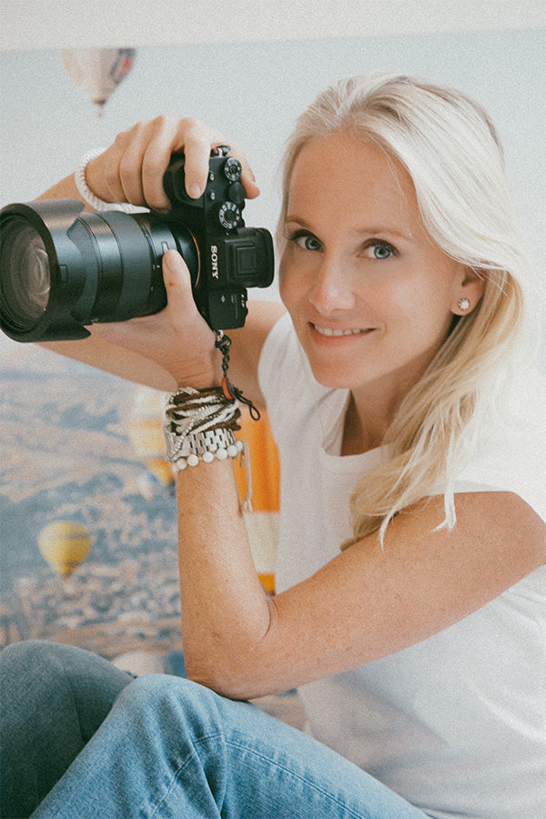 mika holding camera